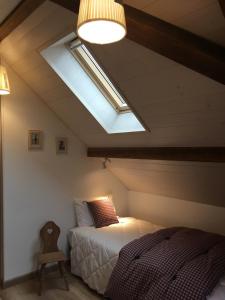 Postel nebo postele na pokoji v ubytování Gîte sainte Famille