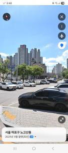 a car parked in a parking lot in a city at 더 신촌스테이 레지던스 in Seoul