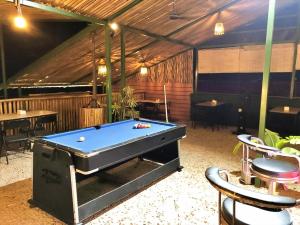 a pool table in the middle of a room at Hotel Peaceland Lumbini in Rummindei