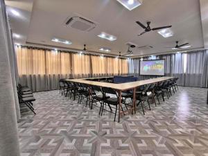 a conference room with a large table and chairs at Hotel Peaceland Lumbini in Rummindei