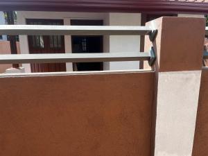 a railing on the side of a building at Maria Ceylon Villa in Tangalle +2 photos
