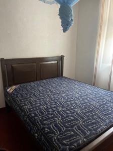 a bed in a bedroom with a bedspread on it at Maria Ceylon Villa in Tangalle