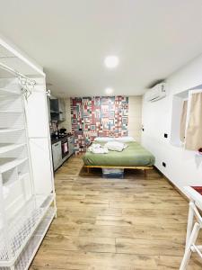 a bedroom with a bed and a closet at Touch&Go - Stanza privata con servizi in Ciampino