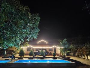 a house at night with lights in front of it at Villa Mountain Pearl in Chikmagalūr