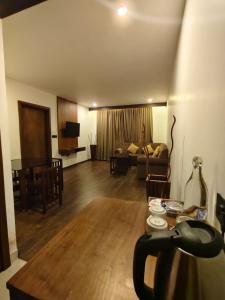 a living room with a couch and a table at HOTEL SKY PARADISE in Iritti