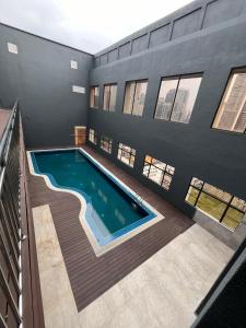 a swimming pool in the middle of a building at Brisdale International Kuala Lumpur in Kuala Lumpur