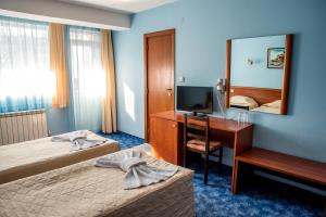 Postel nebo postele na pokoji v ubytování Bariakov Family Hotel