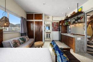 a bedroom with a bed and a couch in a room at Romantic Zone in Puerto Vallarta