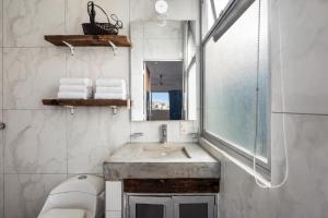 a bathroom with a sink and a mirror at Romantic Zone in Puerto Vallarta +31 photos