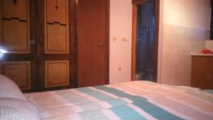 Postel nebo postele na pokoji v ubytování Apartments T&M