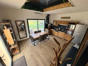 an aerial view of a kitchen and dining room with a table at L Amy-Côtier in Saint-Pierre-dʼOléron +14 photos