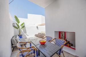 a dining room with a table and chairs at Coral Alvor Old Town Marina Townhouses Collection in Alvor