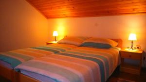 Postel nebo postele na pokoji v ubytování Apartments T&M