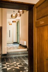 a hallway with a door and a tile floor at Luxury B&B The Belgian Girl in Ghent