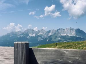 a view of the mountains from the top of a hill at Hotel Alpin Tyrol - Kitzbüheler Alpen in Sankt Johann in Tirol
