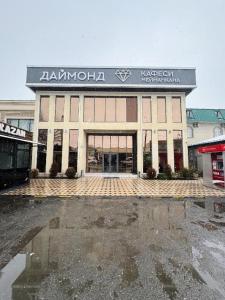 a building with a sign on the front of it at Diamond Hotel Даймонд Отель in Var-Kyshtak