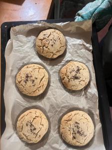 a cookie tray with four cookies on it at Yogstel - Backpackers Hostel in Dūta