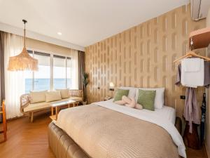 a bedroom with a large bed and a couch at Maldives Beach Resort in Chao Lao Beach +198 photos