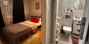 a small bedroom with a bed and a bathroom at InCentrum Pańska 3 in Warsaw +15 photos