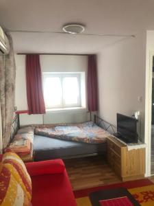 a small bedroom with a bed and a window at Appartement Studio 1 Punat Insel Krk in Punat