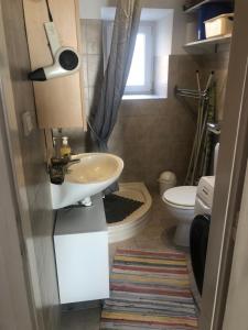 a bathroom with a sink and a toilet at Appartement Studio 1 Punat Insel Krk in Punat