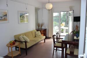 a living room with a couch and a table at Art.Villa.Nike in Koinyra