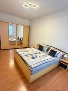 a bedroom with a large bed in a room at U potůčku in Ledce
