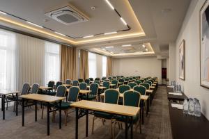 a conference room with tables and chairs in it at Marhaba Hotel & Spa in Tashkent