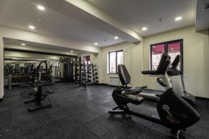 a gym with several treadmills and elliptical machines at Marhaba Hotel & Spa in Tashkent +20 photos