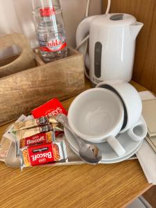 a table with a cup of coffee and a plate of food at Whitaker Lodge in Swinford