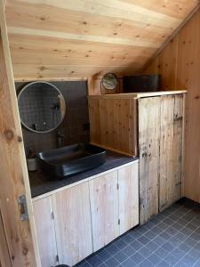 a bathroom with a sink and a mirror at Urastova in Vassenden +25 photos