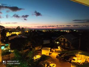 a view of a city lit up at night at Cozy & Zen in Saint-Denis +3 photos