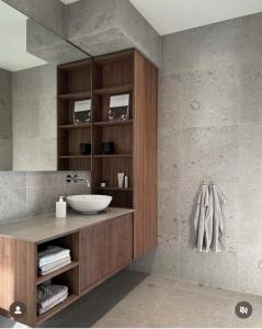 a bathroom with a sink and a mirror at FairMounts Plaza Inns Near Delhi International Airport in New Delhi