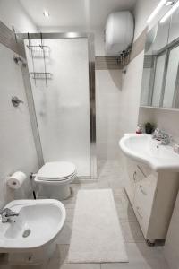 a bathroom with a shower and a toilet and a sink at Casa vacanza da Paola in Trapani +18 photos
