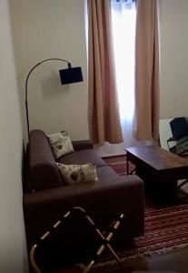 a living room with a couch and a table at La Luna dei Medici in Fivizzano