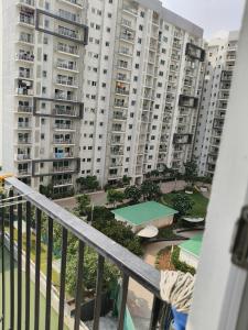 a view of a large apartment building from a balcony at 1 BHK apartment in Bangalore
