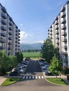 an aerial view of a parking lot with parked cars at Brasov Altipiani Apartments in Braşov