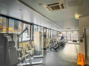 a gym with cardio equipment in a building at Harbour Haven Sleep 7 Free Parking Free Tram to CBD in Melbourne