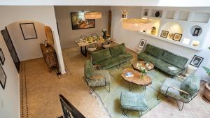 an overhead view of a living room with green furniture at Riad Al Jadd - 5 Bedrooms - Pool - Breakfast in Marrakesh