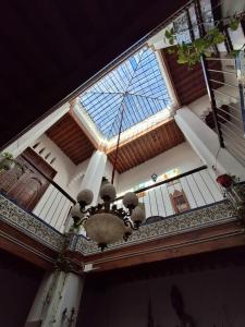 a chandelier hanging from the ceiling of a building at hostel four seasons in Tétouan