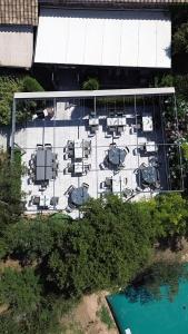 an overhead view of a parking lot with chairs and a pool at Le Mas Saint Donat in Sainte-Maxime