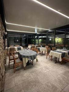 a restaurant with tables and chairs in a building at Le Mas Saint Donat in Sainte-Maxime +72 photos