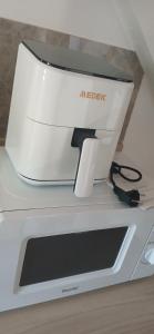 a white sewing machine sitting on top of a counter at La maisonnette in Coulombs +3 photos