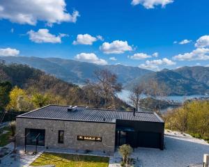 a stone house with a view of the mountains at Chestnut hill - Geres in Ventosa