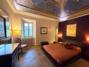 a bedroom with a bed and a coffered ceiling at L' Appartamento Experience in Tivoli