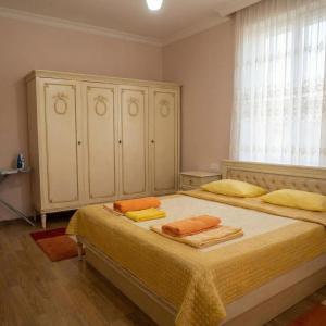 a bedroom with a bed with two towels on it at Sea View villa in Baku +20 photos