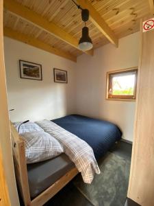 a bedroom with a bed in a small room at Physio House Sokolik in Komarno