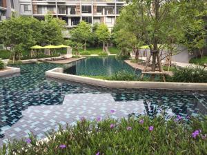 a swimming pool in the middle of a building at The 23 Estate by Away in Phayayen