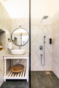 a bathroom with a sink and a mirror at Casa Century Anjuna in Anjuna +26 photos