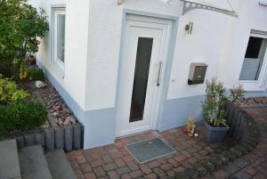 a door on a house with a brick walkway at Ferienwohnung in Bad Schwalbach in Bad Schwalbach +12 photos